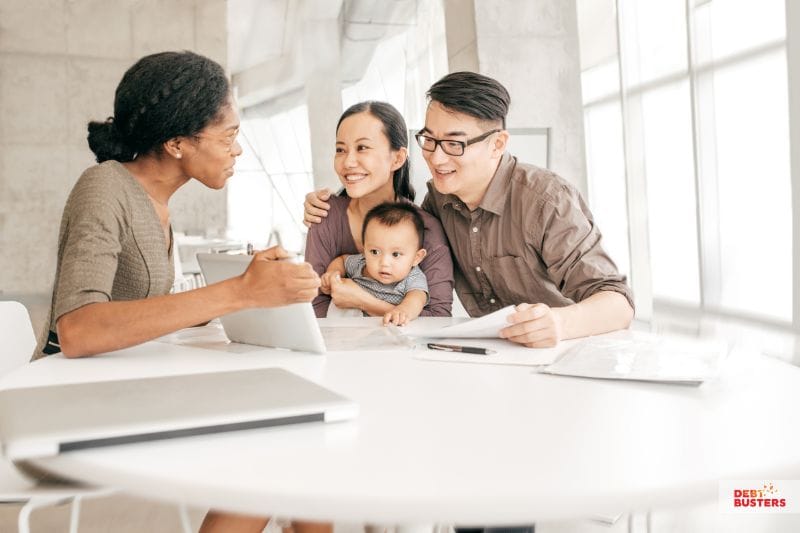 Family receiving financial advice to manage debt and understand bankruptcy vs insolvency